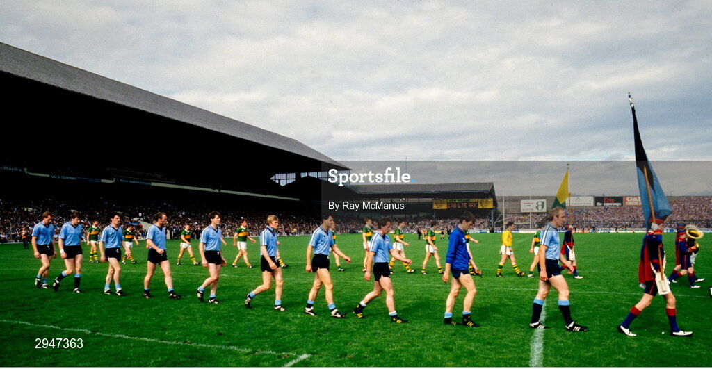 22 September 1985; Dublin captain Brian Mullins leads his team during the pre-match parade before the All Ireland Football Championship Final match between Kerry and Dublin at Croke Park, Dublin. Photo by Ray McManus/Sportsfile