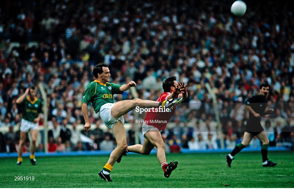 16 September 1990; Gerry McEntee of Meath in action against Shea Fahy of Cork, watched by referee Paddy Russell, during the All-Ireland Senior Football Championship final between Cork and Meath at Croke Park in Dublin. Photo by Ray McManus/Sportsfile