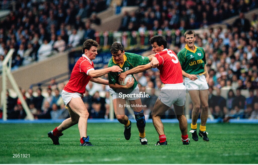 16 September 1990; Colm O'Rourke of Meath is tackled by Steven O'Brien, left, and Mick Slocum of Cork during the All-Ireland Senior Football Championship final between Cork and Meath at Croke Park in Dublin. Photo by Ray McManus/Sportsfile