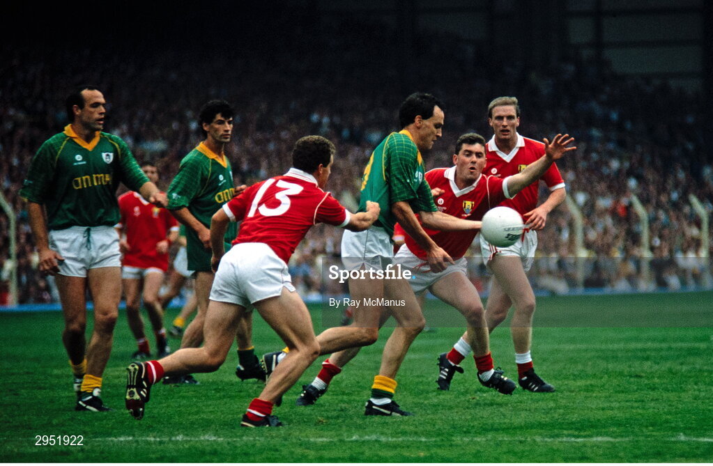 16 September 1990; Gerry McEntee of Meath in action against Paul McGrath, left, Michael McCarthy and Larry Tompkins of Cork during the All-Ireland Senior Football Championship final between Cork and Meath at Croke Park in Dublin. Photo by Ray McManus/Sportsfile