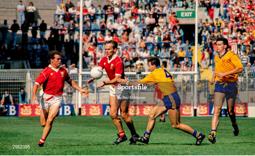 12 August 1990; Colm O'Neill of Cork passes to teammate Paul McGrath as Des Newton of Roscommon closes in during the All-Ireland Senior Football Championship Semi-Final match between Cork and Roscommon at Croke Park in Dublin. Photo by Ray McManus/Sportsfile