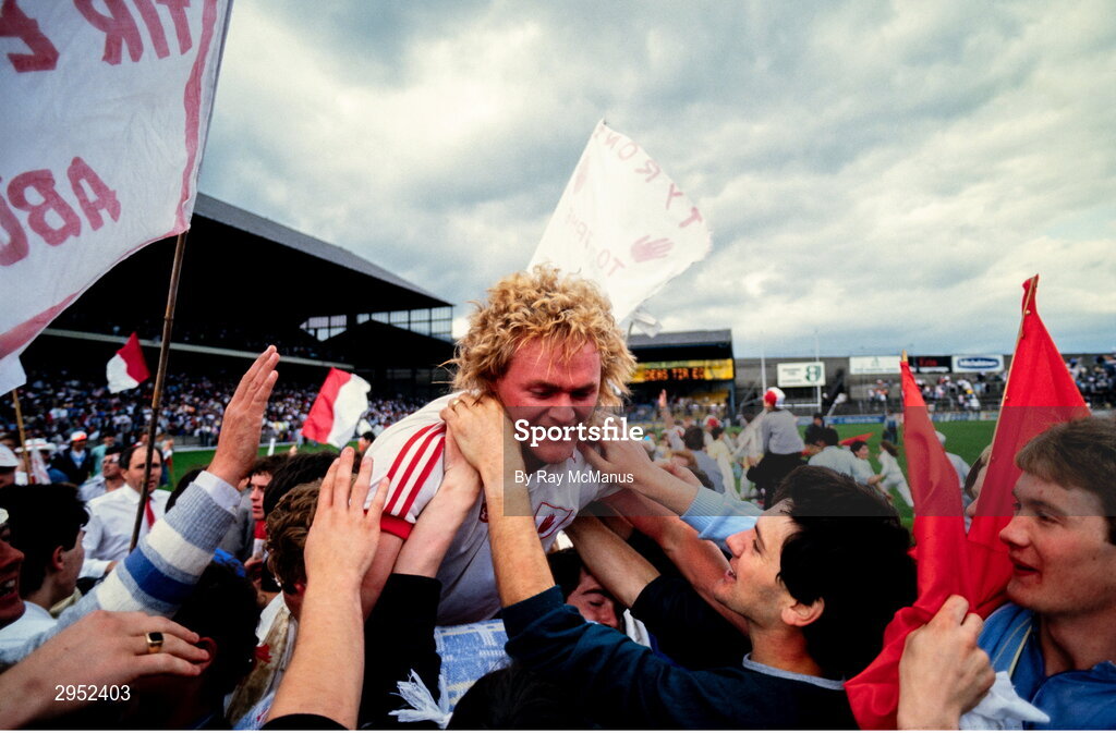 17 August 1986; John Lynch of Tyrone celebrates with supporters after their side's victory in the All-Ireland Senior Football Championship Semi-Final match between Tyrone and Galway at Croke Park in Dublin. Photo by Ray McManus/Sportsfile