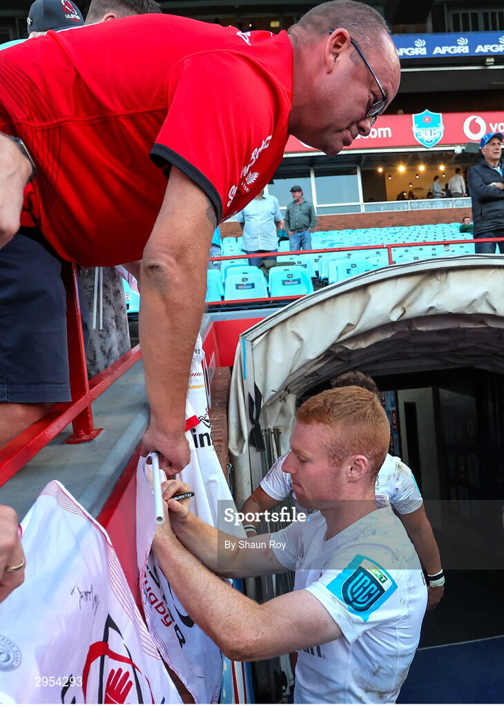 5 October 2024; Nathan Doak of Ulster signs an autograph for a supporter after the United Rugby Championship match between Vodacom Bulls and Ulster at Loftus Versfeld Stadium in Pretoria, South Africa. Photo by Shaun Roy/Sportsfile