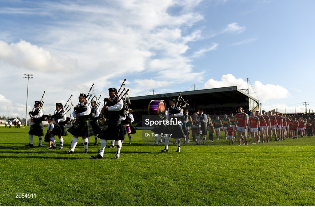 6 October 2024; A view of both teams in the parade behind the Killeshin Pipe Band before the Carlow County Senior Football Championship final match between Rathvilly and Palatine at Netwatch Cullen Park in Carlow. Photo by Tom Beary/Sportsfile