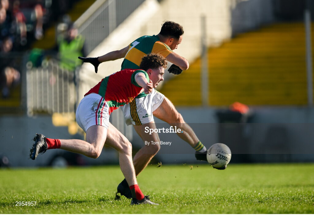 6 October 2024; Eric Molloy of Rathvilly shoots to score his side's first goal despite the attempts of Jack Deacy of Palatine during the Carlow County Senior Football Championship final match between Rathvilly and Palatine at Netwatch Cullen Park in Carlow. Photo by Tom Beary/Sportsfile