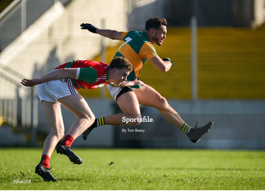 6 October 2024; Eric Molloy of Rathvilly shoots to score his side's first goal despite the attempts of Jack Deacy of Palatine during the Carlow County Senior Football Championship final match between Rathvilly and Palatine at Netwatch Cullen Park in Carlow. Photo by Tom Beary/Sportsfile