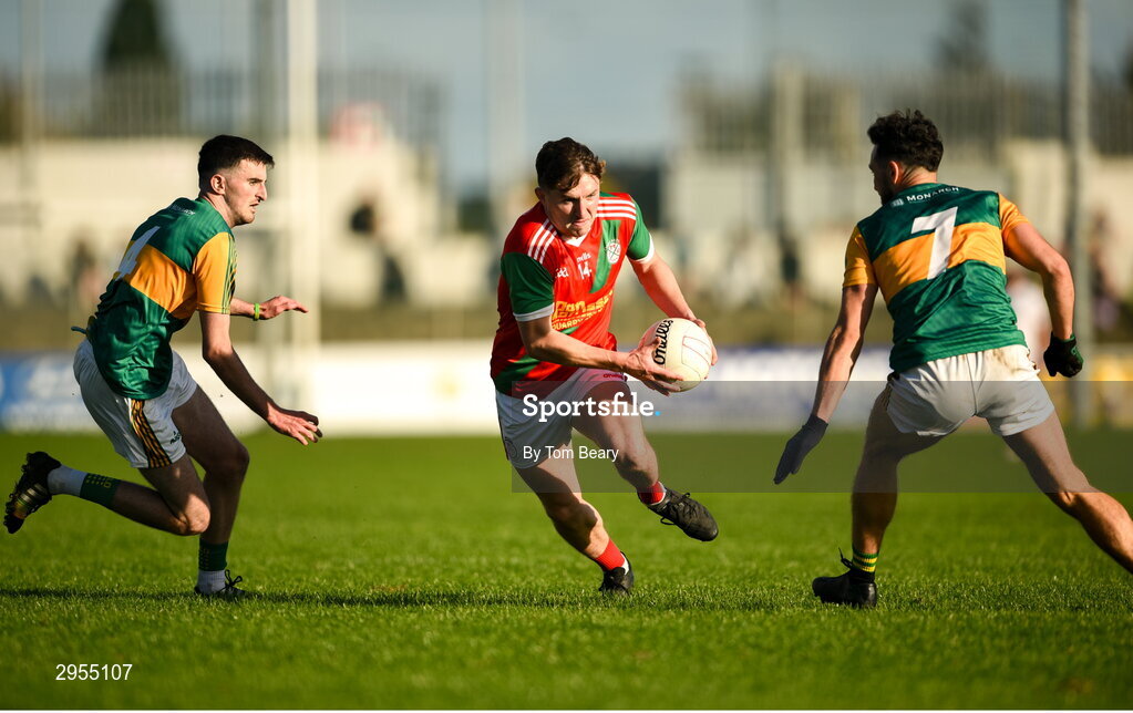 6 October 2024; Conor Crowley of Palatine in action against Páraic Deering, left, and Eric Molloy of Rathvilly during the Carlow County Senior Football Championship final match between Rathvilly and Palatine at Netwatch Cullen Park in Carlow. Photo by Tom Beary/Sportsfile