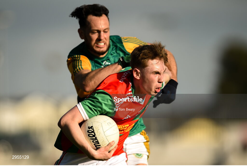 6 October 2024; Finbarr Kavanagh of Palatine is tackled by Eric Molloy of Rathvilly during the Carlow County Senior Football Championship final match between Rathvilly and Palatine at Netwatch Cullen Park in Carlow. Photo by Tom Beary/Sportsfile