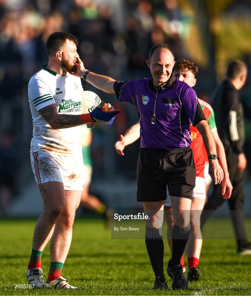 6 October 2024; Palatine goalkeeper Craig Kearney in conversation with referee John Hickey after the drawn Carlow County Senior Football Championship final match between Rathvilly and Palatine at Netwatch Cullen Park in Carlow. Photo by Tom Beary/Sportsfile