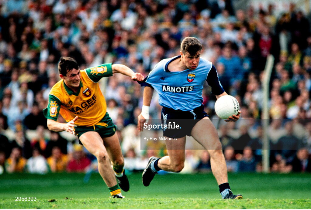 9 May 1993; Charlie Redmond of Dublin is tackled by John Joe Doherty of Donegal during the Royal Liver Assurance National Football League Final Replay match between Dublin and Donegal at Croke Park in Dublin. Photo by Ray McManus/Sportsfile