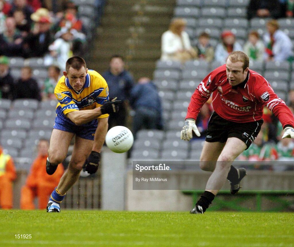 22 August 2004; Odran O'Dwyer, Clare, punches the ball  past the Sligo goalkeeper James Curran to score a goal. Tommy Murphy Cup Final, Clare v Sligo, Croke Park, Dublin. Picture credit; Ray McManus / SPORTSFILE