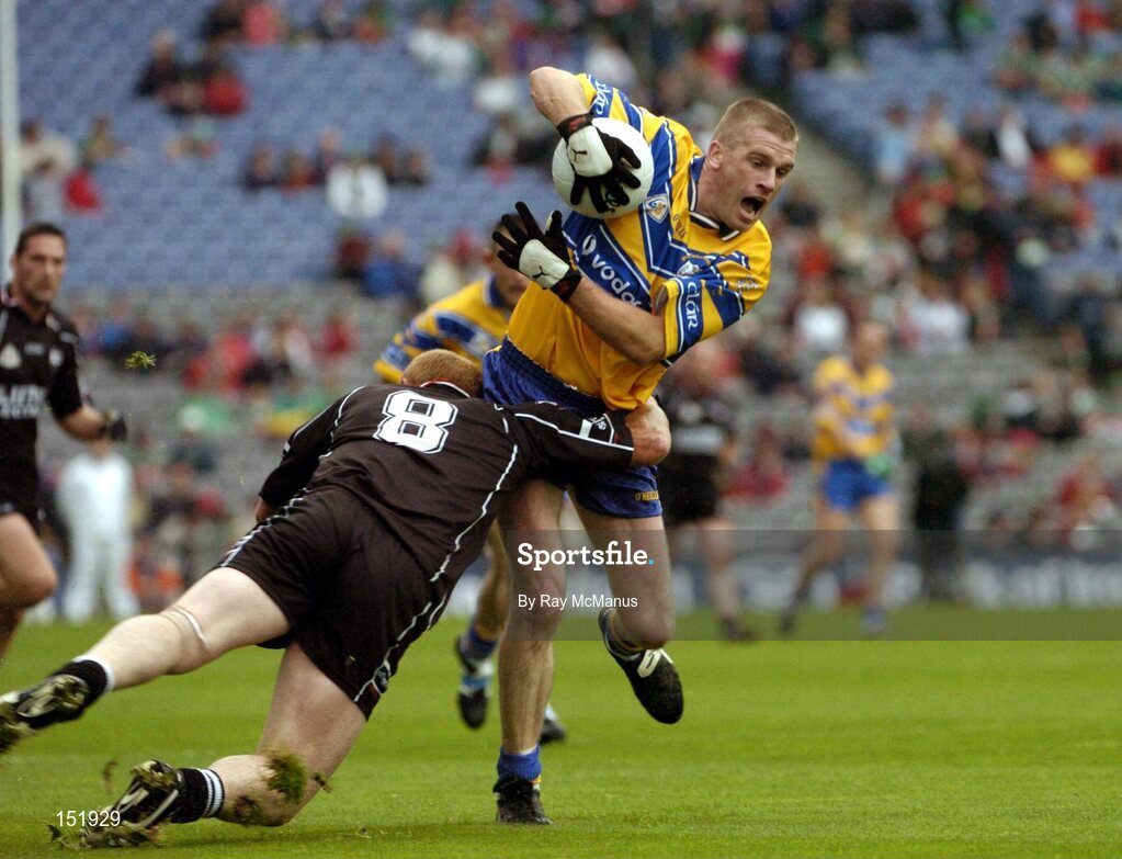 22 August 2004; Ger Quinlan, Clare, is tackled by Gary Maye, Sligo. Tommy Murphy Cup Final, Clare v Sligo, Croke Park, Dublin. Picture credit; Ray McManus / SPORTSFILE