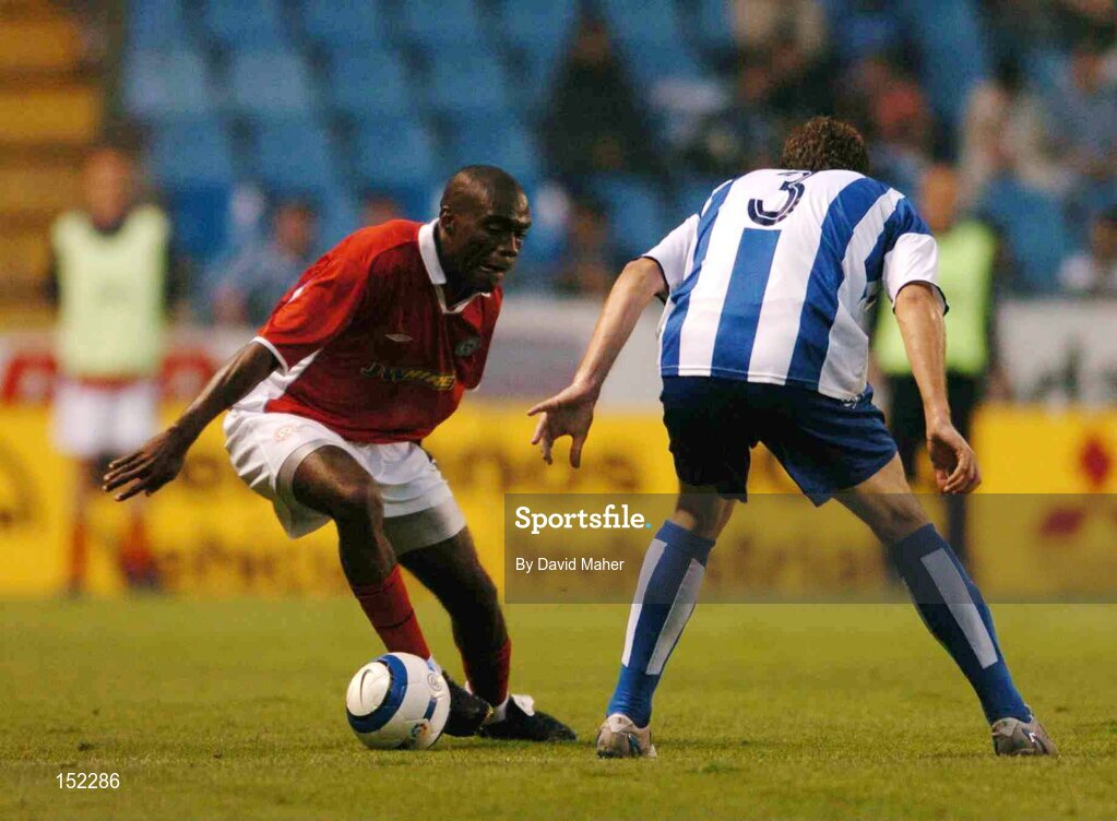 24 August 2004; Joseph Ndo, Shelbourne, in action against Enrique Romero, Deportivo La Coruna. UEFA Champions League, 3rd Round Second Leg Qualifier, Deportivo La Coruna v Shelbourne, Riazor stadium. La Coruna, Spain. Picture credit; David Maher / SPORTSFILE