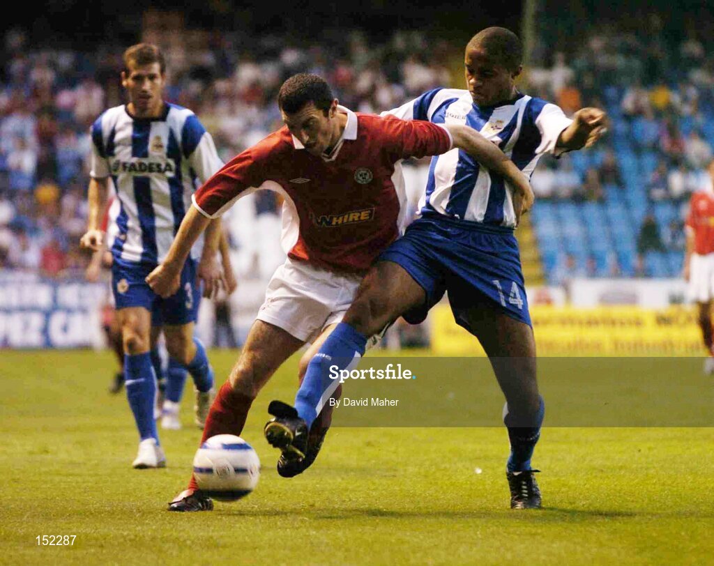 24 August 2004; Jason Byrne, Shelbourne, in action against Jorge Andrade, Deportivo La Coruna. UEFA Champions League, 3rd Round Second Leg Qualifier, Deportivo La Coruna v Shelbourne, Riazor stadium. La Coruna, Spain. Picture credit; David Maher / SPORTSFILE