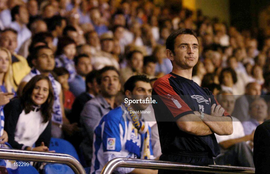 24 August 2004; Pat Fenlon, Shelbourne manager, watches from the stands having been sent off during the second half. UEFA Champions League, 3rd Round Second Leg Qualifier, Deportivo La Coruna v Shelbourne, Riazor stadium. La Coruna, Spain. Picture credit; David Maher / SPORTSFILE