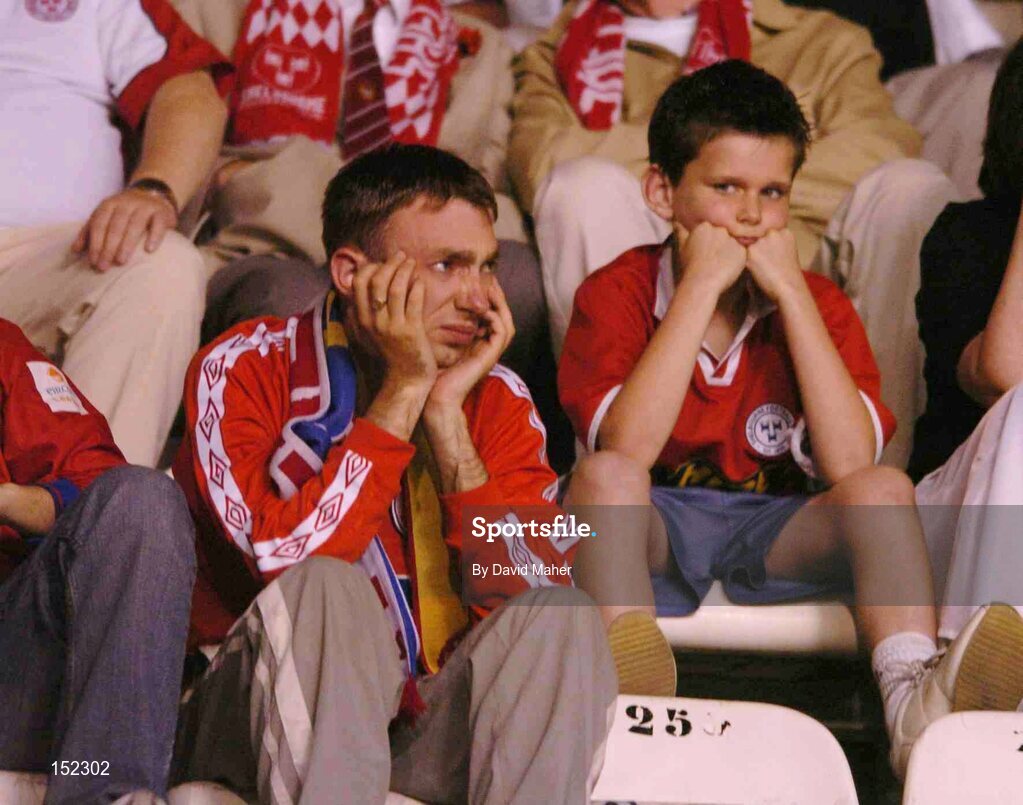 24 August 2004; Dejected Shelbourne supporters after defeat to Deportivo La Coruna. UEFA Champions League, 3rd Round Second Leg Qualifier, Deportivo La Coruna v Shelbourne, Riazor stadium. La Coruna, Spain. Picture credit; David Maher / SPORTSFILE