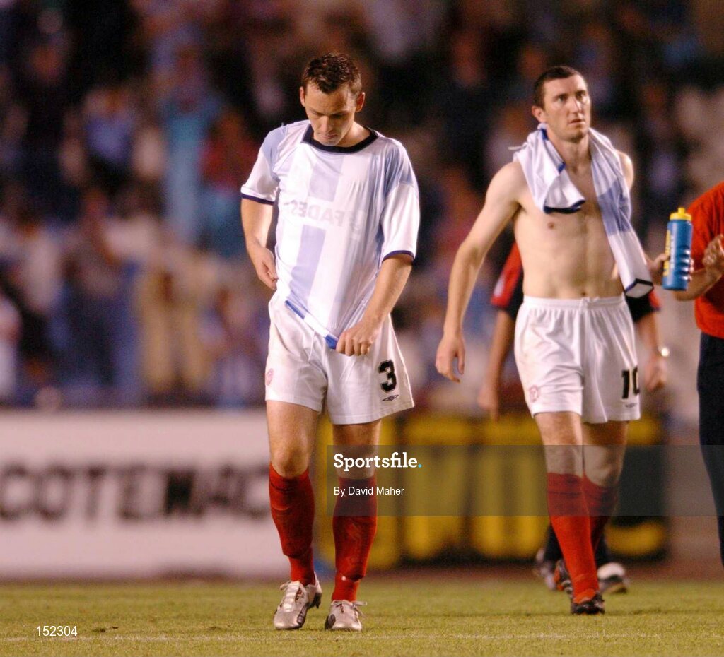 24 August 2004; Dejected Shelbourne players David Crawley, left, and Jason Byrne, at the end of the game, after defeat to Deportivo La Coruna. UEFA Champions League, 3rd Round Second Leg Qualifier, Deportivo La Coruna v Shelbourne, Riazor stadium. La Coruna, Spain. Picture credit; David Maher / SPORTSFILE