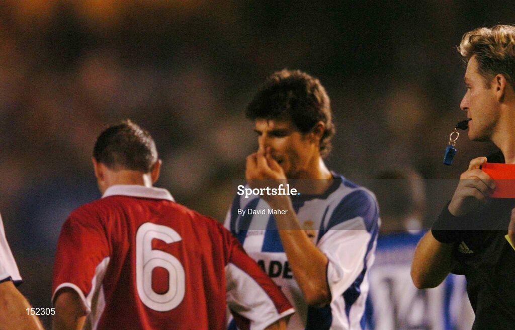 24 August 2004; Referee Alain Hamer shows the red card to Alan Moore, Shelbourne, during the second half. UEFA Champions League, 3rd Round Second Leg Qualifier, Deportivo La Coruna v Shelbourne, Riazor stadium. La Coruna, Spain. Picture credit; David Maher / SPORTSFILE