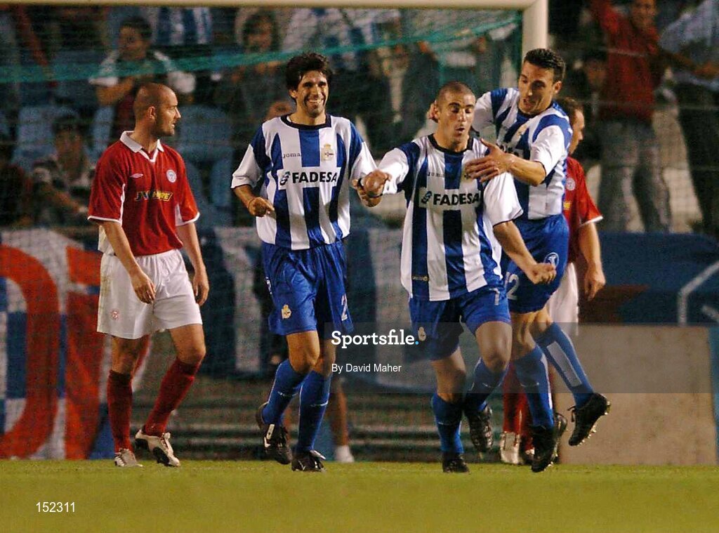 24 August 2004; Walter Pandiani, second from right, Deportivo La Coruna, celebrates after scoring his sides third goal with team-mates Juan Carlos Valeron, second from left and Lionel Scaloni as Dave Rogers shelbourne looks on. UEFA Champions League, 3rd Round Second Leg Qualifier, Deportivo La Coruna v Shelbourne, Riazor stadium. La Coruna, Spain. Picture credit; David Maher / SPORTSFILE