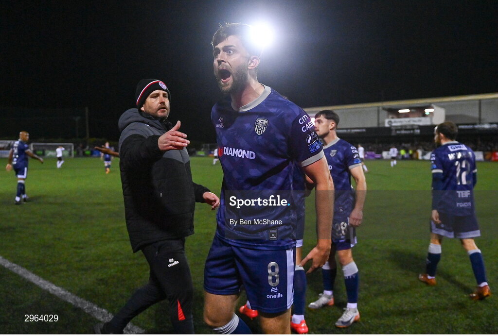 18 October 2024; Will Patching of Derry City celebrates with Derry City manager Ruaidhrí Higgins, left, after scoring their side's second goal during the SSE Airtricity Men's Premier Division match between Dundalk and Derry City at Oriel Park in Dundalk, Louth. Photo by Ben McShane/Sportsfile
