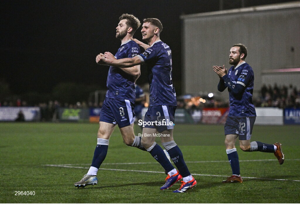 18 October 2024; Will Patching of Derry City celebrates with teammates Ronan Boyce, centre, and Paul McMullan, right, after scoring their side's second goal during the SSE Airtricity Men's Premier Division match between Dundalk and Derry City at Oriel Park in Dundalk, Louth. Photo by Ben McShane/Sportsfile