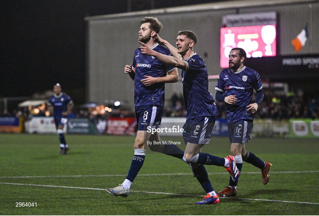 18 October 2024; Will Patching of Derry City celebrates with teammates Ronan Boyce, centre, and Paul McMullan, right, after scoring their side's second goal during the SSE Airtricity Men's Premier Division match between Dundalk and Derry City at Oriel Park in Dundalk, Louth. Photo by Ben McShane/Sportsfile