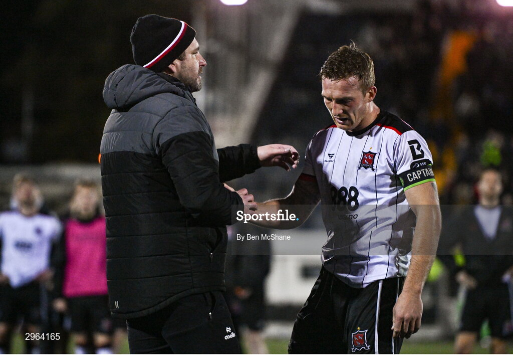 18 October 2024; Derry City manager Ruaidhrí Higgins consoles an emotional Dundalk captain John Mountney after the SSE Airtricity Men's Premier Division match between Dundalk and Derry City at Oriel Park in Dundalk, Louth. Photo by Ben McShane/Sportsfile