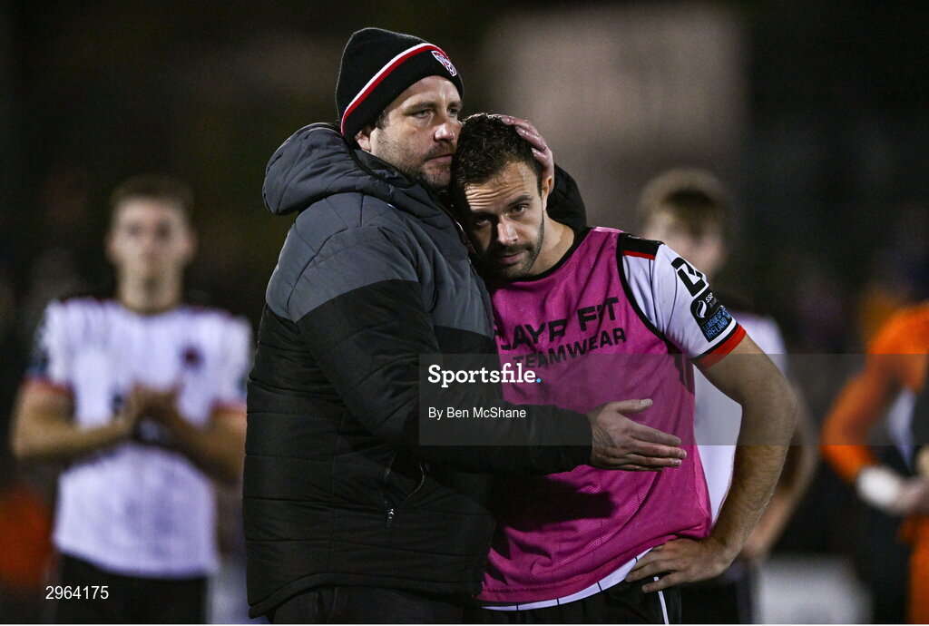 18 October 2024; Robbie Benson of Dundalk is consoled by Derry City manager Ruaidhrí Higgins after the SSE Airtricity Men's Premier Division match between Dundalk and Derry City at Oriel Park in Dundalk, Louth. Photo by Ben McShane/Sportsfile
