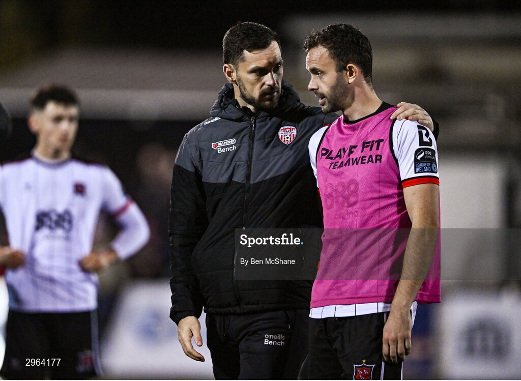 18 October 2024; Robbie Benson of Dundalk is consoled by Patrick Hoban of Derry City after the SSE Airtricity Men's Premier Division match between Dundalk and Derry City at Oriel Park in Dundalk, Louth. Photo by Ben McShane/Sportsfile