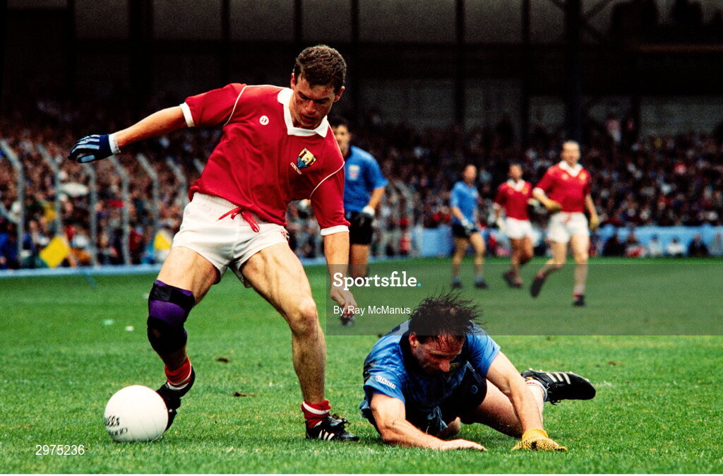 20 August 1989; Mick Kennedy of Dublin falls down next to Paul McGrath of Cork during the All-Ireland Senior Football Championship Semi-Final match between Cork and Dublin at Croke Park in Dublin. Photo by Ray McManus/Sportsfile