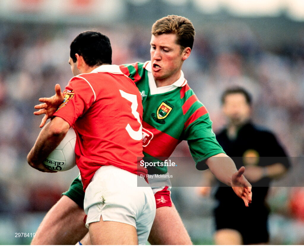 15 August 1993; Mark O'Connor of Cork is tackled by Ray Dempsey of Mayo during the GAA All Ireland Senior Football Semi-Final match between Cork and Mayo at Croke Park in Dublin. Photo by Ray McManus/Sportsfile