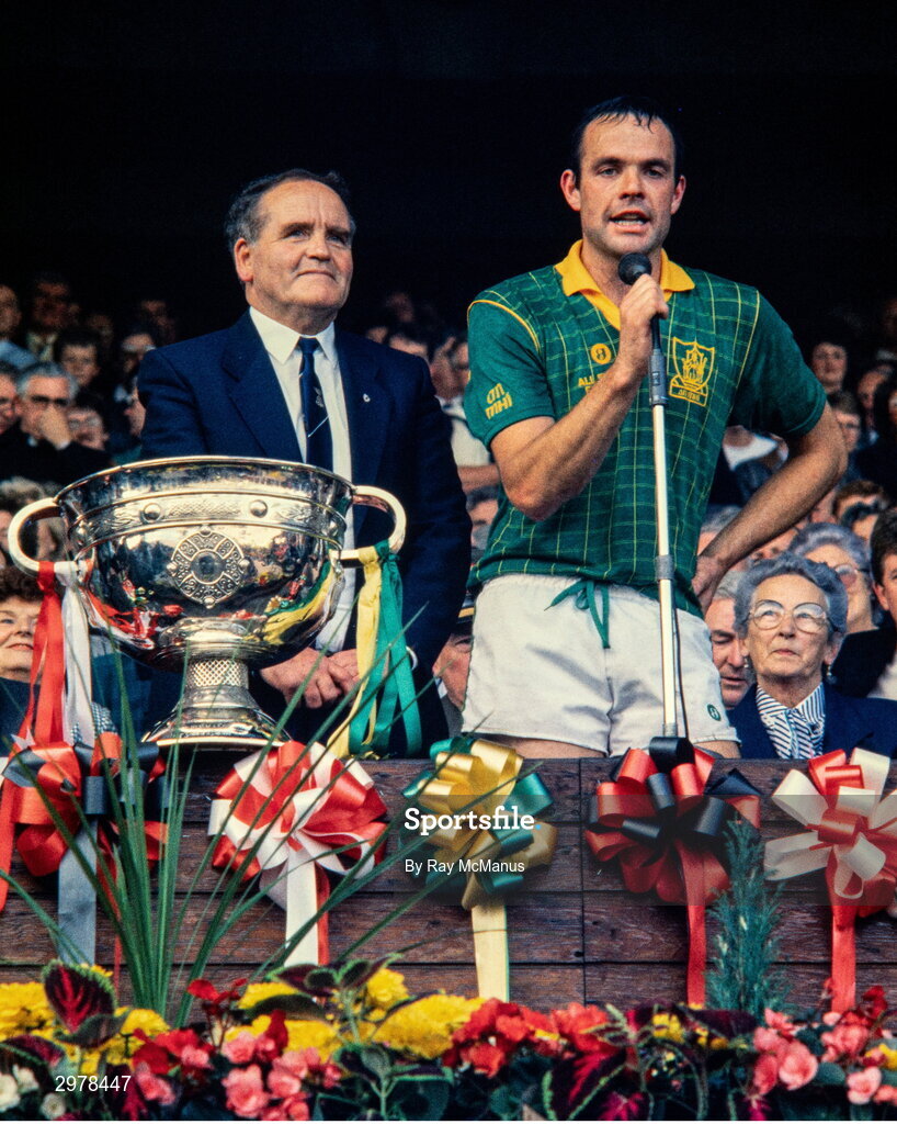 20 September 1987; Meath captain Mick Lyons, in the company of the Uachtarán Chumann Lúthchleas Gael Dr Mick Loftus, as he makes his speech after the All-Ireland Senior Football Championship Final match between Meath and Cork at Croke Park in Dublin. Photo by Ray McManus/Sportsfile