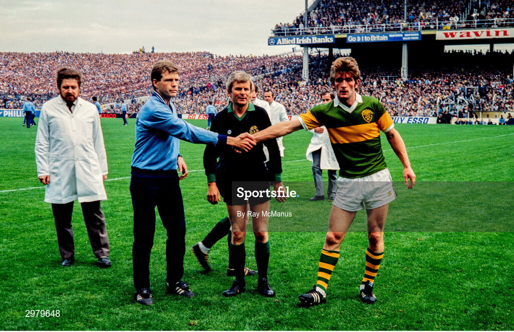 23 September 1984; Team captains Tommy Drumm of Dublin, left, and Ambrose O'Donovan of Kerry shake hands, in the company of referee Paddy Collins, before the GAA All-Ireland Senior Football Championship final between Kerry and Dublin at Croke Park in Dublin. Photo by Ray McManus/Sportsfile