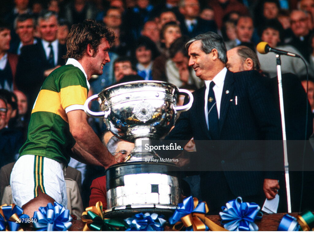 23 September 1984; Kerry captain Ambrose O'Donovan is congratulated by GAA President Paddy Buggy after the GAA All-Ireland Senior Football Championship final between Kerry and Dublin at Croke Park in Dublin. Photo by Ray McManus/Sportsfile