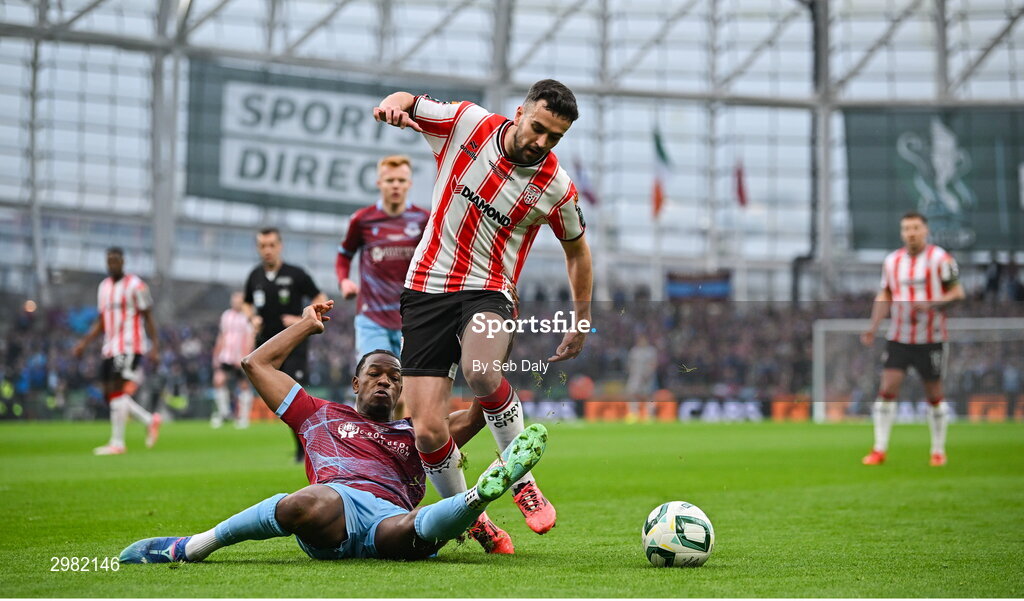 10 November 2024; Michael Duffy of Derry City is tackled by Elicha Ahui of Drogheda United during the Sports Direct Men's FAI Cup Final match between Drogheda United and Derry City at the Aviva Stadium in Dublin. Photo by Seb Daly/Sportsfile