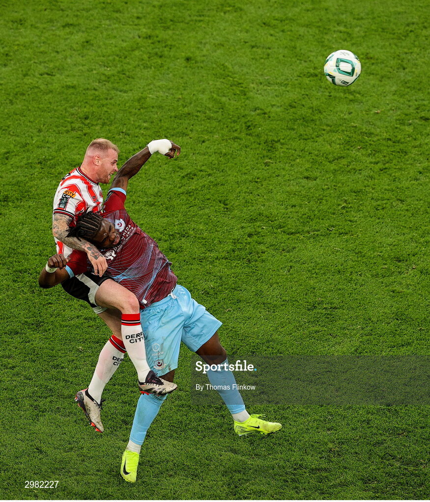 10 November 2024; Mark Connolly of Derry City in action against Frantz Pierrot of Drogheda United during the Sports Direct Men's FAI Cup Final match between Drogheda United and Derry City at the Aviva Stadium in Dublin. Photo by Thomas Flinkow/Sportsfile