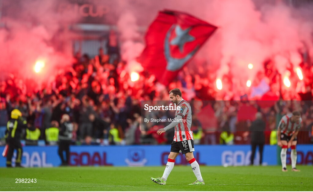 10 November 2024; A dejected Paul McMullan of Derry City as Drogheda United supporters celebrate their side's first goal during the Sports Direct Men's FAI Cup Final match between Drogheda United and Derry City at the Aviva Stadium in Dublin. Photo by Stephen McCarthy/Sportsfile