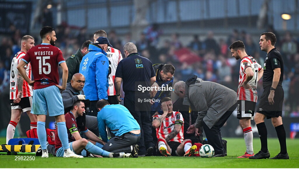 10 November 2024; Ryan Brennan of Drogheda United and Patrick McEleney of Derry City receive medical treatment during the Sports Direct Men's FAI Cup Final match between Drogheda United and Derry City at the Aviva Stadium in Dublin. Photo by Seb Daly/Sportsfile