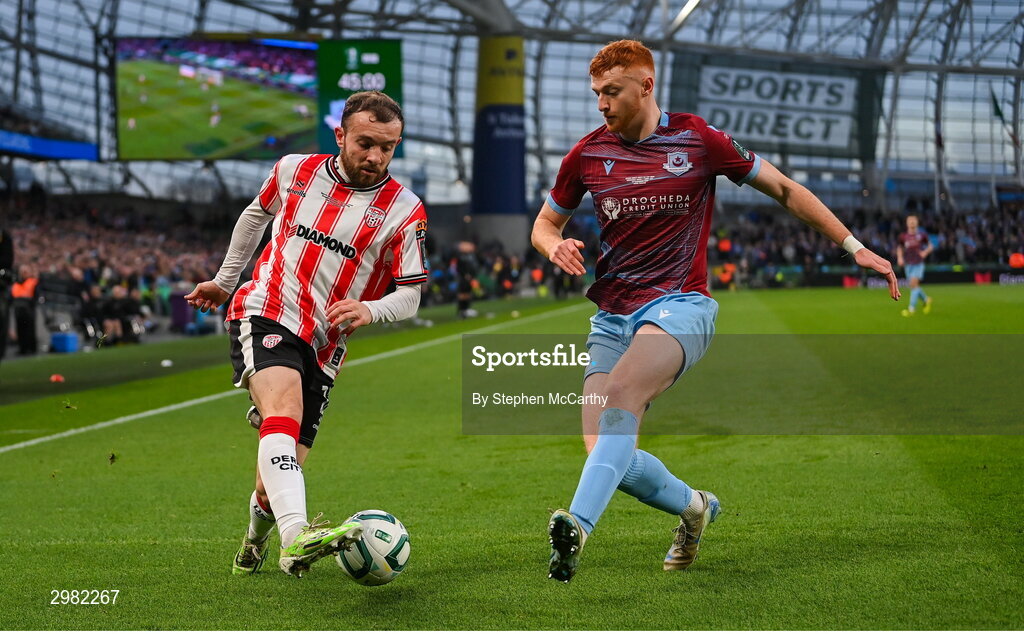 10 November 2024; Paul McMullan of Derry City in action against James Bolger of Drogheda United during the Sports Direct Men's FAI Cup Final match between Drogheda United and Derry City at the Aviva Stadium in Dublin. Photo by Stephen McCarthy/Sportsfile
