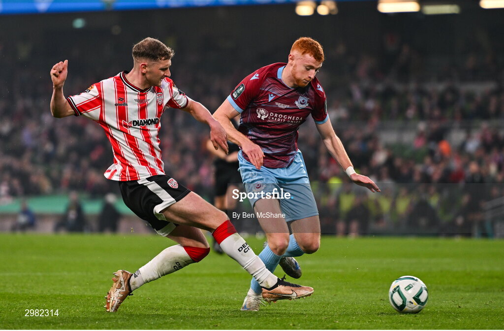 10 November 2024; Ronan Boyce of Derry City in action against James Bolger of Drogheda United during the Sports Direct Men's FAI Cup Final match between Drogheda United and Derry City at the Aviva Stadium in Dublin. Photo by Ben McShane/Sportsfile