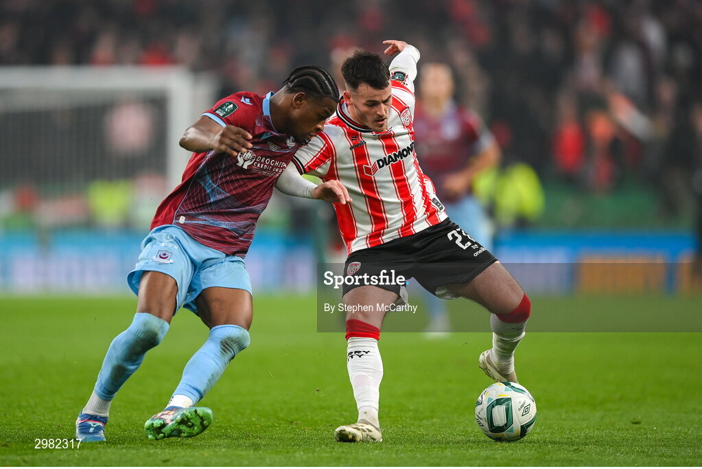 10 November 2024; Danny Mullen of Derry City is tackled by Elicha Ahui of Drogheda United during the Sports Direct Men's FAI Cup Final match between Drogheda United and Derry City at the Aviva Stadium in Dublin. Photo by Stephen McCarthy/Sportsfile