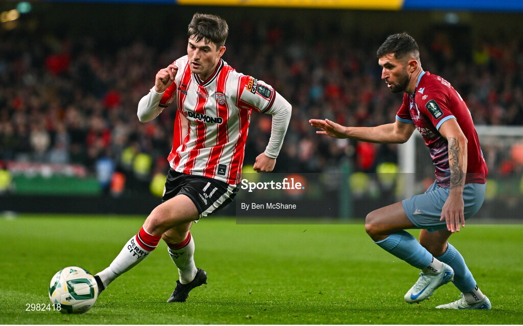 10 November 2024; Colm Whelan of Derry City in action against Luke Heeney of Drogheda United during the Sports Direct Men's FAI Cup Final match between Drogheda United and Derry City at the Aviva Stadium in Dublin. Photo by Ben McShane/Sportsfile
