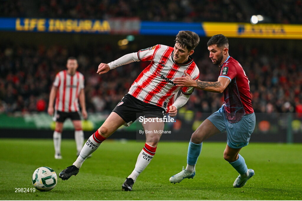 10 November 2024; Colm Whelan of Derry City in action against Luke Heeney of Drogheda United during the Sports Direct Men's FAI Cup Final match between Drogheda United and Derry City at the Aviva Stadium in Dublin. Photo by Ben McShane/Sportsfile