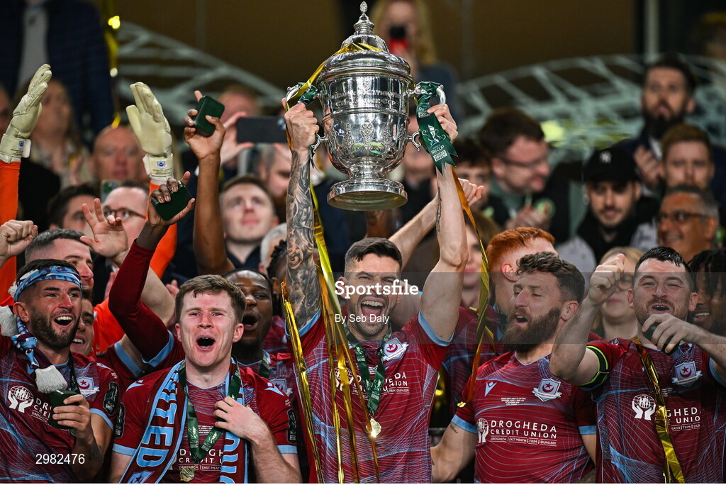 10 November 2024; Adam Foley of Drogheda United, centre, and teammates celebrate with the FAI Cup after the Sports Direct Men's FAI Cup Final match between Drogheda United and Derry City at the Aviva Stadium in Dublin.  Photo by Seb Daly/Sportsfile