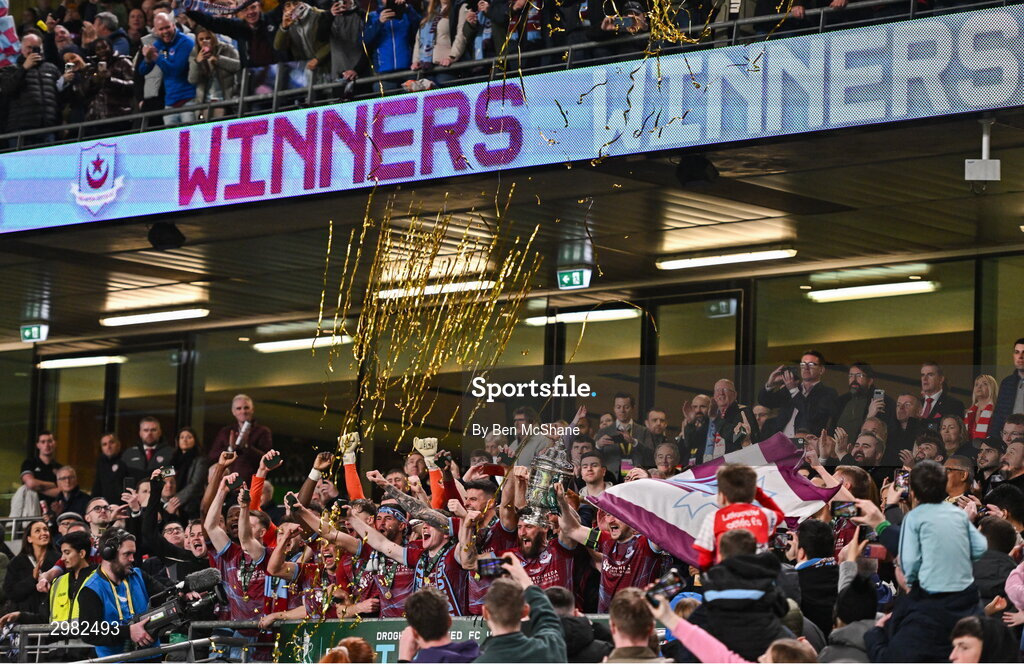 10 November 2024; Drogheda United players celebrate with the FAI cup after the Sports Direct Men's FAI Cup Final match between Drogheda United and Derry City at the Aviva Stadium in Dublin. Photo by Ben McShane/Sportsfile