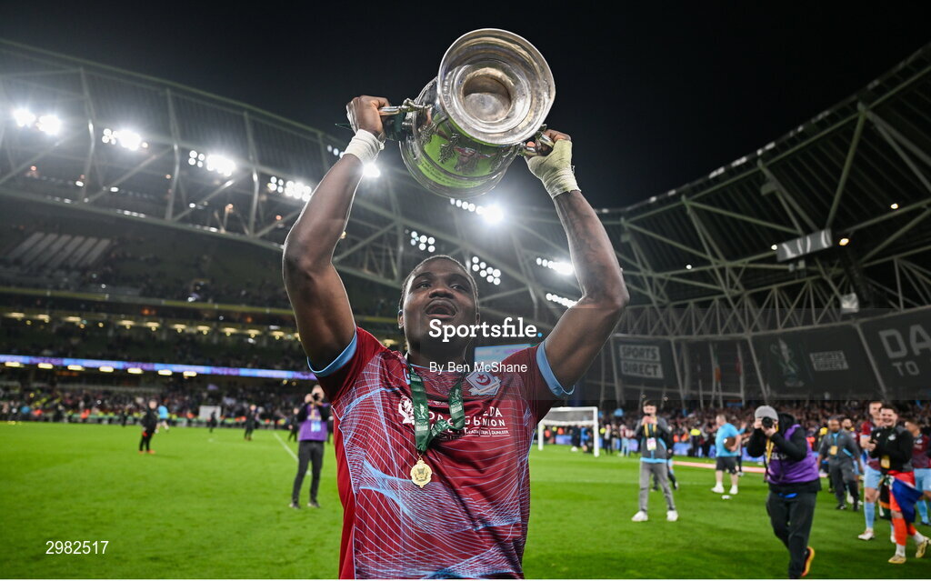 10 November 2024; Frantz Pierrot of Drogheda United celebrates with the cup after the Sports Direct Men's FAI Cup Final match between Drogheda United and Derry City at the Aviva Stadium in Dublin. Photo by Ben McShane/Sportsfile