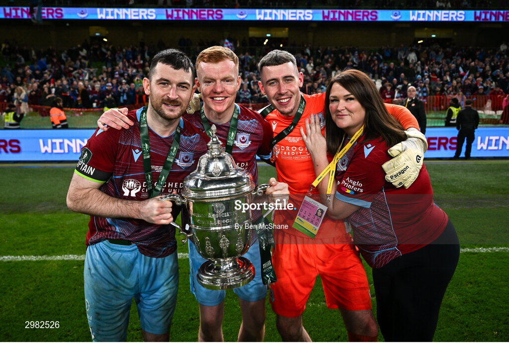 10 November 2024; Drogheda United players, from left, Ryan Brennan, Shane Farrell, Luke Dennison and Joanne Byrne celebrates with the cup after the Sports Direct Men's FAI Cup Final match between Drogheda United and Derry City at the Aviva Stadium in Dublin. Photo by Ben McShane/Sportsfile