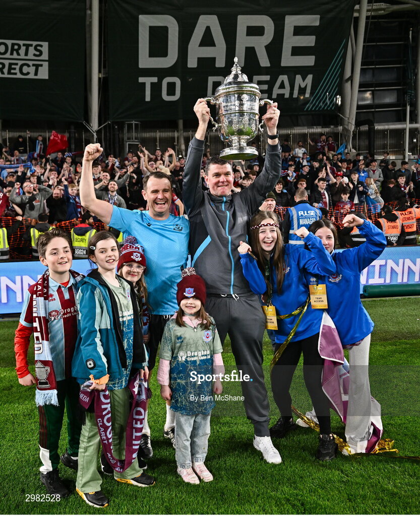 10 November 2024; Drogheda United manager Kevin Doherty and assistant manager Daire Doyle and their families celebrate with the cup after the Sports Direct Men's FAI Cup Final match between Drogheda United and Derry City at the Aviva Stadium in Dublin. Photo by Ben McShane/Sportsfile