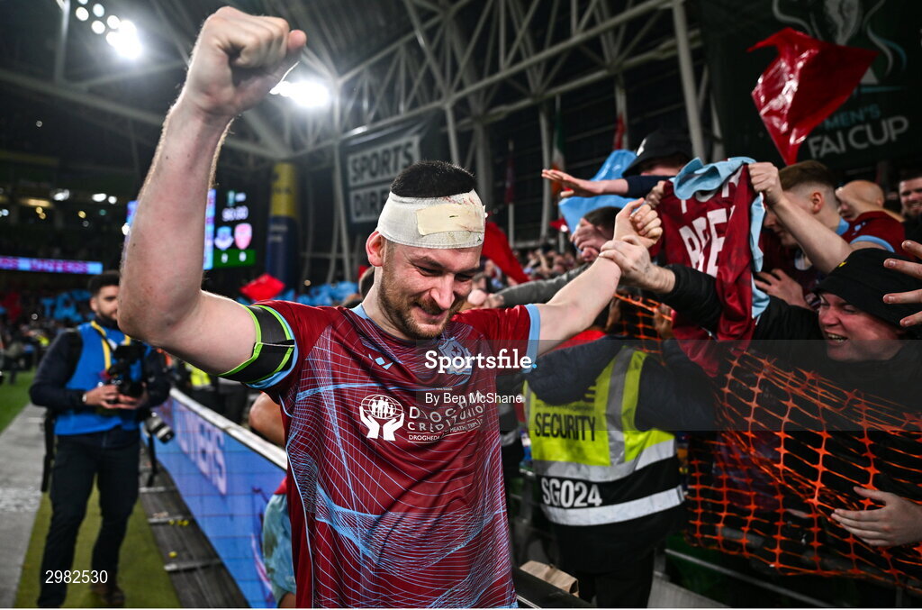 10 November 2024; Ryan Brennan of Drogheda United celebrates with supporters after the Sports Direct Men's FAI Cup Final match between Drogheda United and Derry City at the Aviva Stadium in Dublin. Photo by Ben McShane/Sportsfile