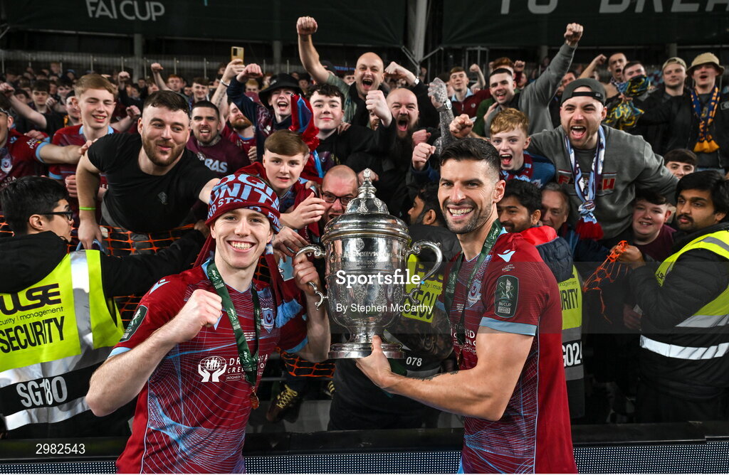 10 November 2024; Drogheda United players Warren Davis, left, and Adam Foley celebrate with the FAI cup after the Sports Direct Men's FAI Cup Final match between Drogheda United and Derry City at the Aviva Stadium in Dublin. Photo by Stephen McCarthy/Sportsfile